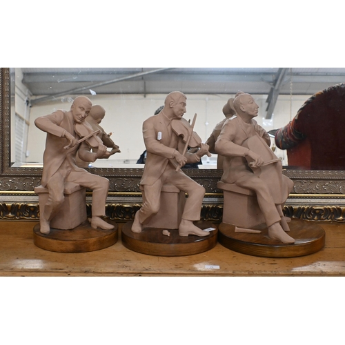 473 - Four large terracotta figures of string musicians on wooden plinths, 40 cm high, signed with monogra... 