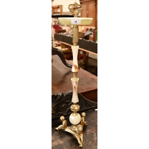 48 - A brass and onyx smoker's companion stand with decorative figures