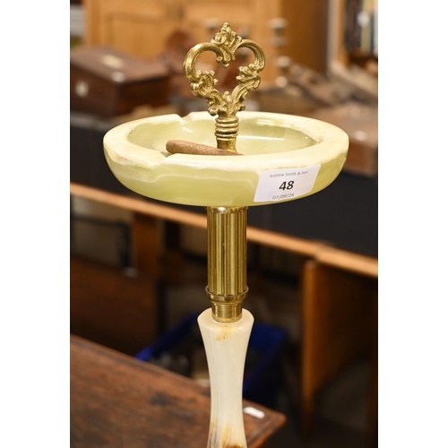 48 - A brass and onyx smoker's companion stand with decorative figures