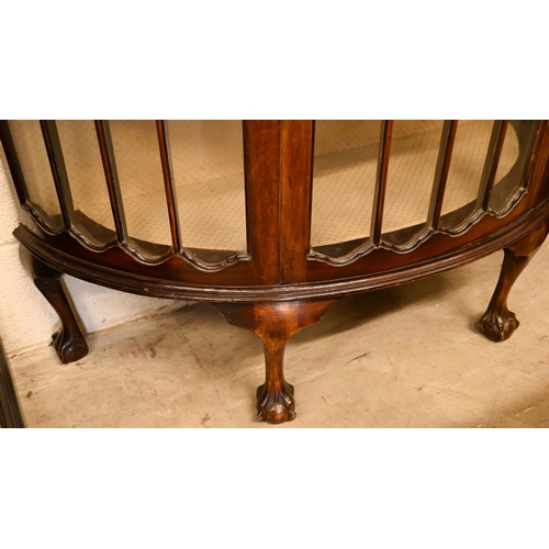 53 - A mahogany bowfront display cabinet on claw and ball feet, 107 cm