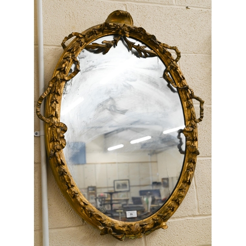 55 - A 19th century wall mirror, the gilt gesso framed embellished with ribbons and foliage, 87 x 64 cm