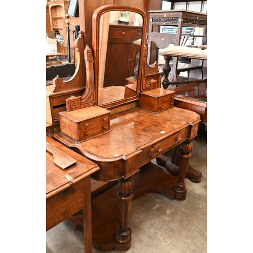 59 - A Victorian walnut Duchess dressing table with swing mirror and four short drawers over frieze drawe... 