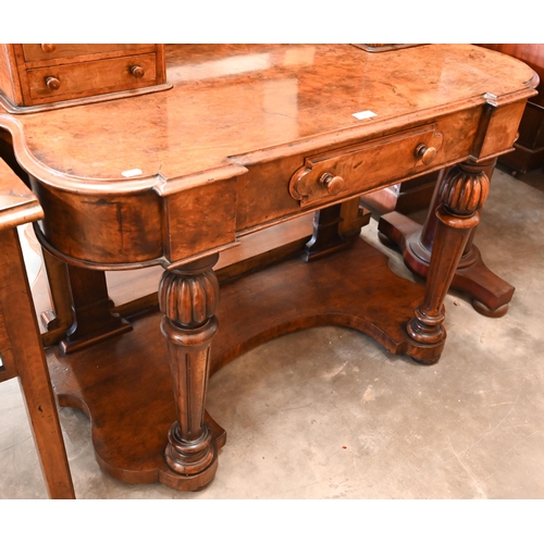 59 - A Victorian walnut Duchess dressing table with swing mirror and four short drawers over frieze drawe... 