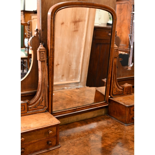 59 - A Victorian walnut Duchess dressing table with swing mirror and four short drawers over frieze drawe... 