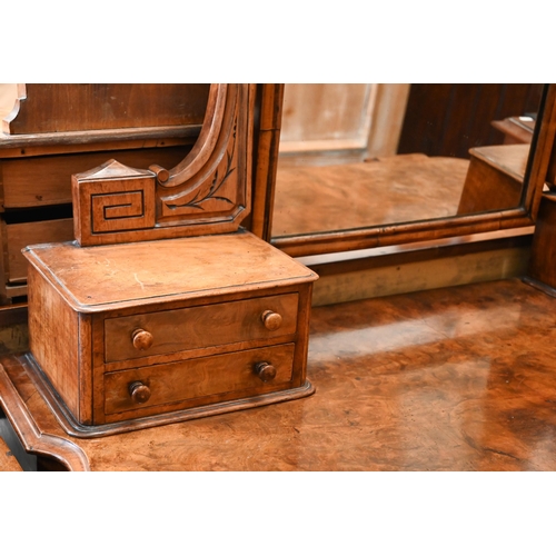 59 - A Victorian walnut Duchess dressing table with swing mirror and four short drawers over frieze drawe... 