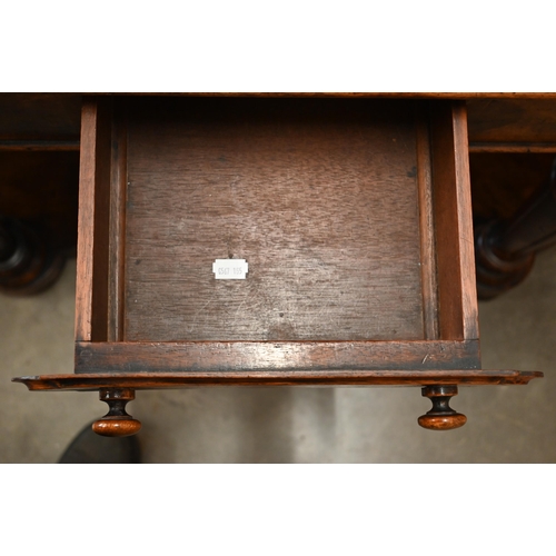 59 - A Victorian walnut Duchess dressing table with swing mirror and four short drawers over frieze drawe... 