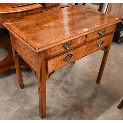 60 - A Georgian walnut side table with two short and one long drawer, on square chamfered supports, 85 cm... 