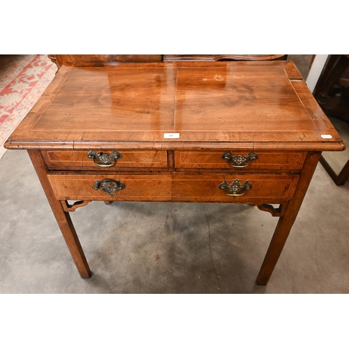 60 - A Georgian walnut side table with two short and one long drawer, on square chamfered supports, 85 cm... 