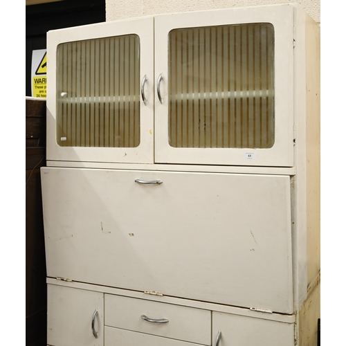 63 - A 1950s vintage kitchen cupboard with etched glass upper doors and melamine drop-front enclosing sto... 