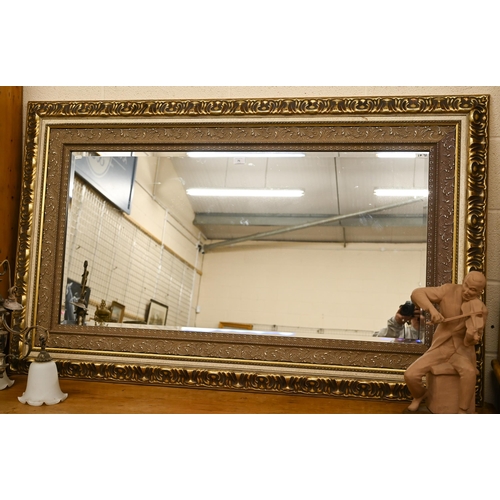 71 - A large modern overmantel mirror with bevelled glass within ornate moulded gilt frame, 156 cm x 96 c... 