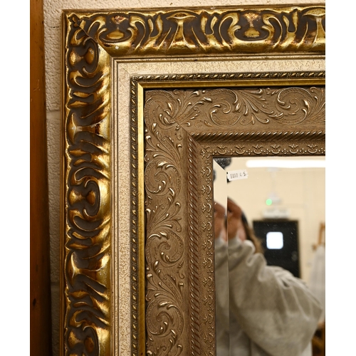 71 - A large modern overmantel mirror with bevelled glass within ornate moulded gilt frame, 156 cm x 96 c... 