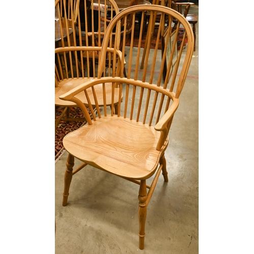 73 - A set of six light elm and ash spindle back Windsor chairs with moulded seats on turned legs with st... 