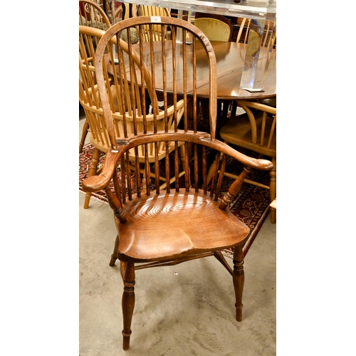 74 - A pair of stained elm and ash spindle back Windsor chairs, 70 cm w x 44 cm d x 110 cm h o/a