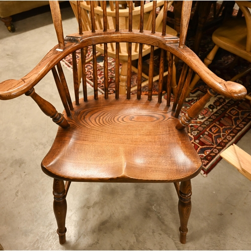 74 - A pair of stained elm and ash spindle back Windsor chairs, 70 cm w x 44 cm d x 110 cm h o/a