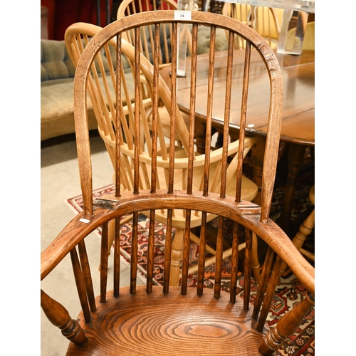 74 - A pair of stained elm and ash spindle back Windsor chairs, 70 cm w x 44 cm d x 110 cm h o/a