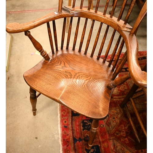 74 - A pair of stained elm and ash spindle back Windsor chairs, 70 cm w x 44 cm d x 110 cm h o/a