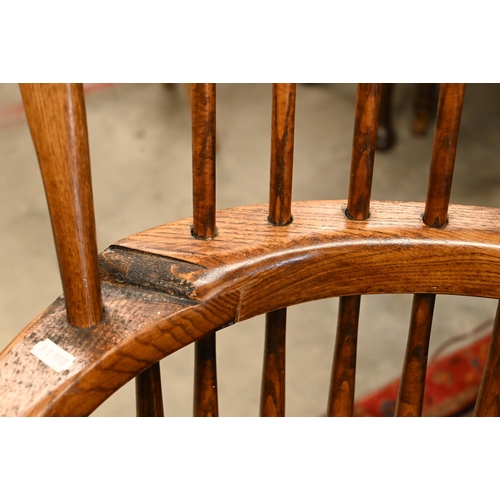 74 - A pair of stained elm and ash spindle back Windsor chairs, 70 cm w x 44 cm d x 110 cm h o/a