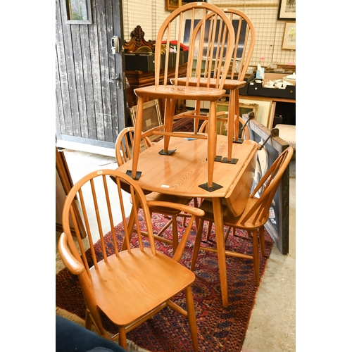 76 - AMENDMENT - A mid-century Ercol Windsor elm and beech dining table with elm drop leaf top (replaced ... 