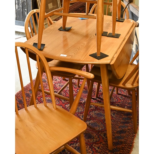 76 - AMENDMENT - A mid-century Ercol Windsor elm and beech dining table with elm drop leaf top (replaced ... 