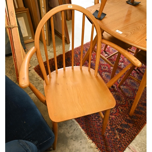 76 - AMENDMENT - A mid-century Ercol Windsor elm and beech dining table with elm drop leaf top (replaced ... 