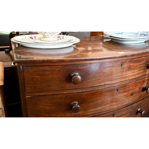 84 - A 19th century mahogany bowfront chest of four long graduating drawers with turned handles and splay... 