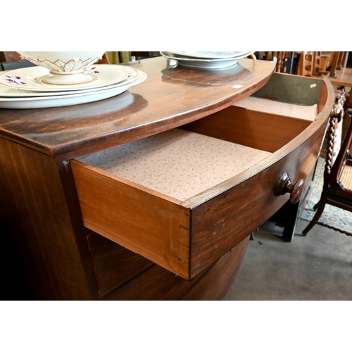 84 - A 19th century mahogany bowfront chest of four long graduating drawers with turned handles and splay... 