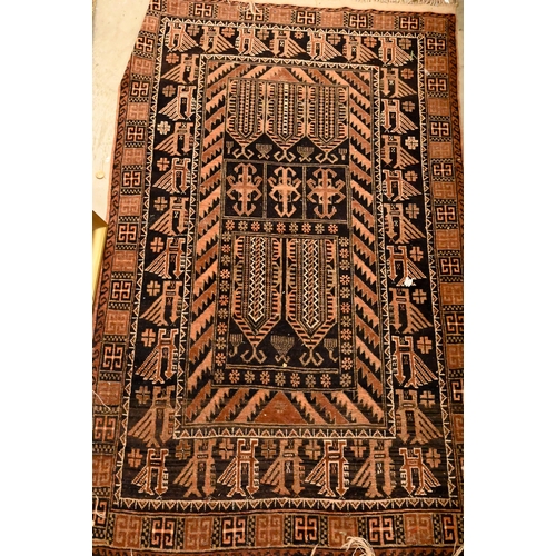 86 - An Afghan Baluch bird design rug, brown ground, 150 cm x 93 cm to/w a soumak rug with geometric band... 