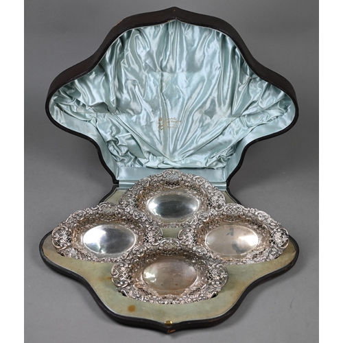 124 - A late Victorian cased set of four embossed, chased and pierced silver bonbon dishes, Henry Matthews... 