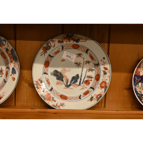 435 - A pair of 19th century Imari palette porcelain plates, painted with bamboo, 23 cm to/w a Japanese Im... 