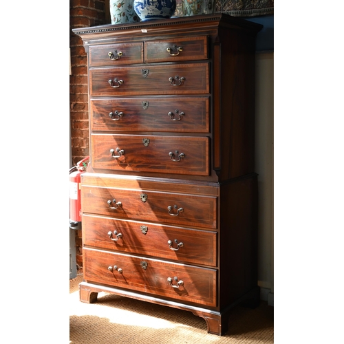 719 - A Victorian cross banded and inlaid bright mahogany chest on chest, the dentil moulded cornice over ... 