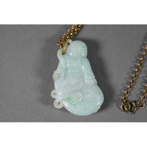 376 - A polished carnelian agate large pendant, 5.5 cm to/w a carved agate frog, 5.5 cm, a jadeite Buddha ... 