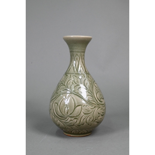 377 - A Chinese Yazhou Northern Celadon vase with incised floral and foliate decoration under the pale oli... 