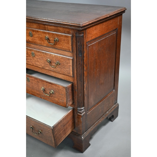 696 - An 18th century Lancashire oak mule chest, the twin plank hinged top over four dummy drawer fronts a... 