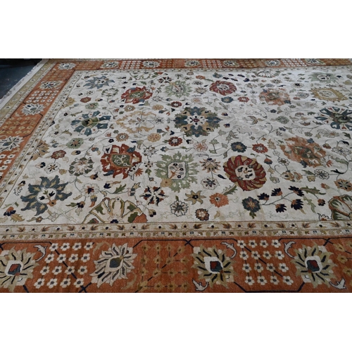 612 - A large contemporary Indo-Persian Tabriz design carpet, the camel ground with floral medallions link... 