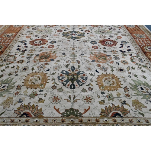 612 - A large contemporary Indo-Persian Tabriz design carpet, the camel ground with floral medallions link... 