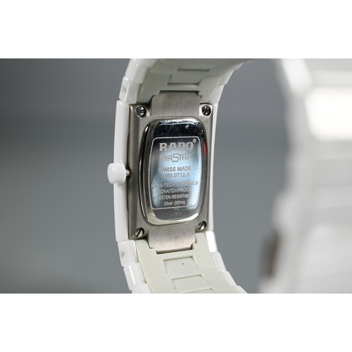 178 - Rado, a white cased lady's wristwatch, quartz movement, on deployment bracelet, with box, manual and... 