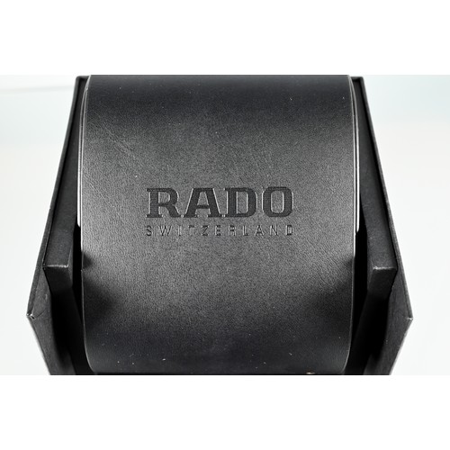 178 - Rado, a white cased lady's wristwatch, quartz movement, on deployment bracelet, with box, manual and... 
