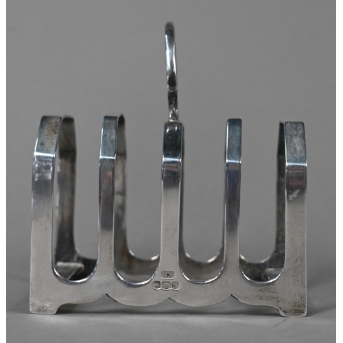 105 - A pair of small silver comports, Asprey & Co, Birmingham 1922, to/w a toast rack, Viners, Sheffi... 