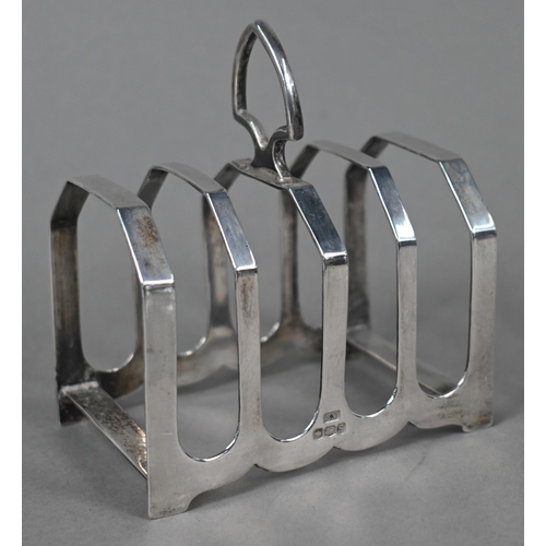 105 - A pair of small silver comports, Asprey & Co, Birmingham 1922, to/w a toast rack, Viners, Sheffi... 