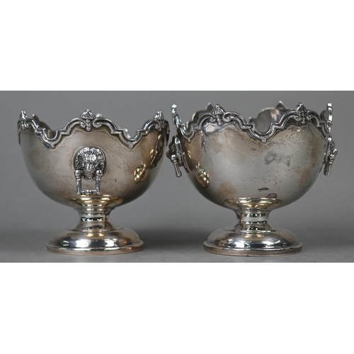 106 - A pair of silver bonbon bowls in the form of miniature monteiths with shaped rims and lion mask and ... 