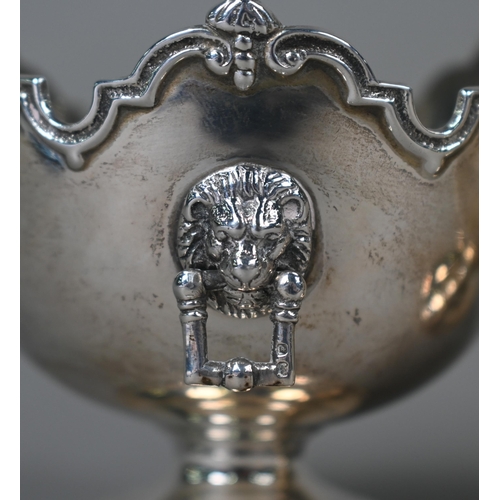 106 - A pair of silver bonbon bowls in the form of miniature monteiths with shaped rims and lion mask and ... 