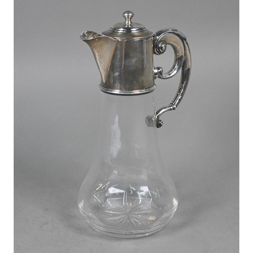 107 - A glass claret jug with star-cut base and silver collar, hinged cover and scroll handle, William Hut... 