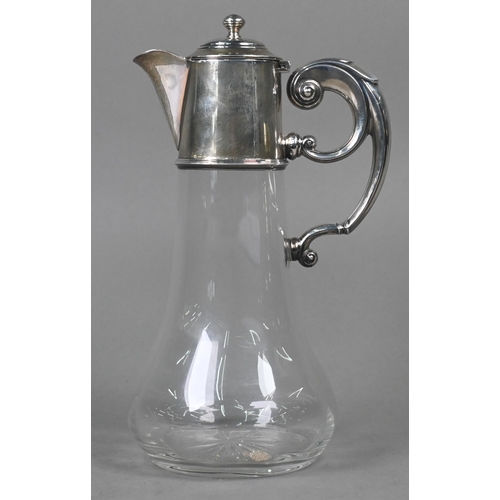 107 - A glass claret jug with star-cut base and silver collar, hinged cover and scroll handle, William Hut... 