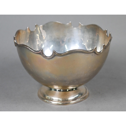 118 - A silver rose bowl with shaped rim and stemmed foot, Barker Brothers Silver Ltd, Birmingham 1932, 10... 