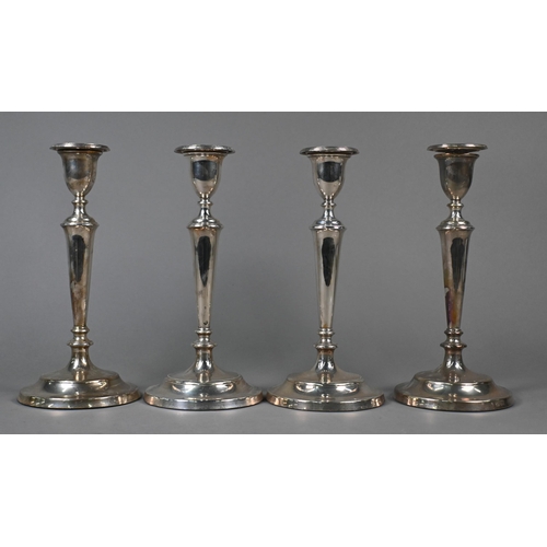 123 - A set of four loaded silver baluster candlesticks with detachable grease-pans, M C Hersey & Son ... 