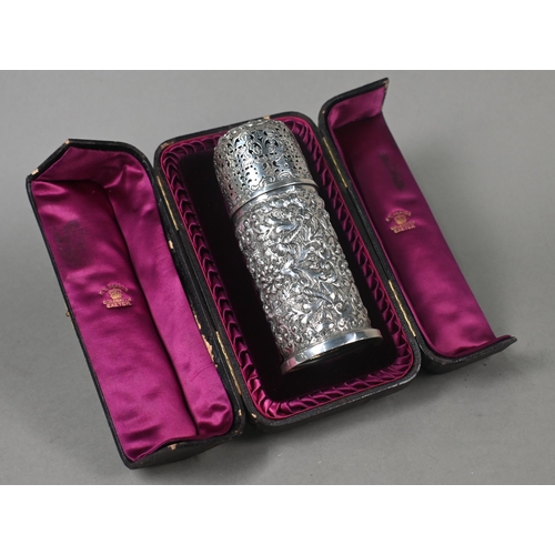 139 - A Victorian cased silver cylindrical sugar caster in the Carolean manner, with pierced domed top, th... 