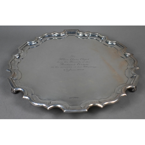 141 - A large silver salver with shaped and moulded rim, on three scroll feet, Lee & Wigfull, Sheffiel... 