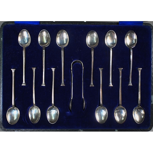 143 - Two silver serving spoons with pierced finials, Harrison Fisher & Co, Sheffield 1920, to/w a cas... 