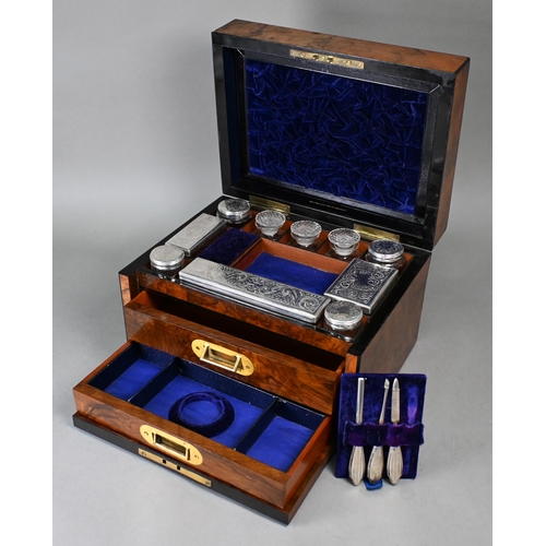 15 - A Victorian walnut dressing case by Greaves (New St, Birmingham), fitted with silver-handled manicur... 