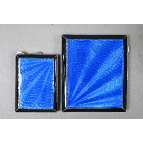 156 - An Art Deco silver cigarette case and matchbook-holder with blue bas-taille and black enamel decorat... 